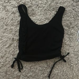 black crop top with ties on the sides